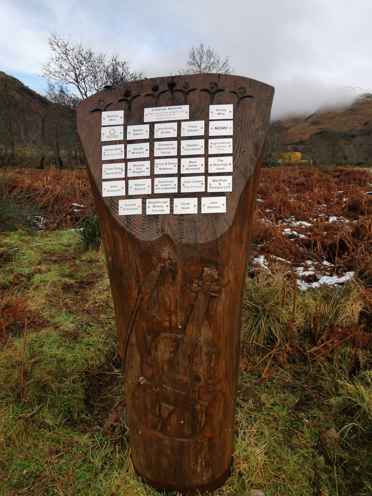 A carved wooden panel on the Glenfinnan path.